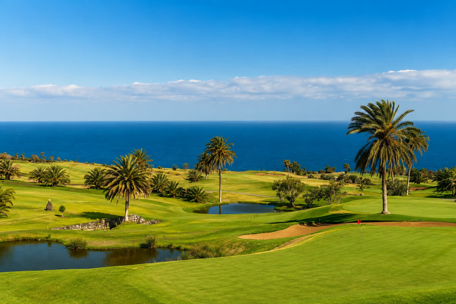Palm-lined green above the Mediterranean